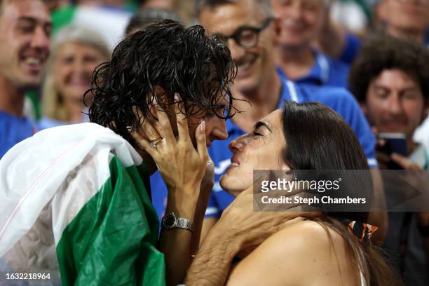Gold medalist Gianmarco Tamberi of Team Italy celebrates winning the Men's High Jump Final with girlfriend Chiara during day four of the World...