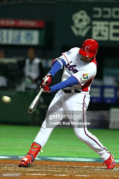 Outfielder Frederich Cepeda of Cuba hits a one-run double in the bottom half of the fourthh inningduring the World Baseball Classic First Round Group...