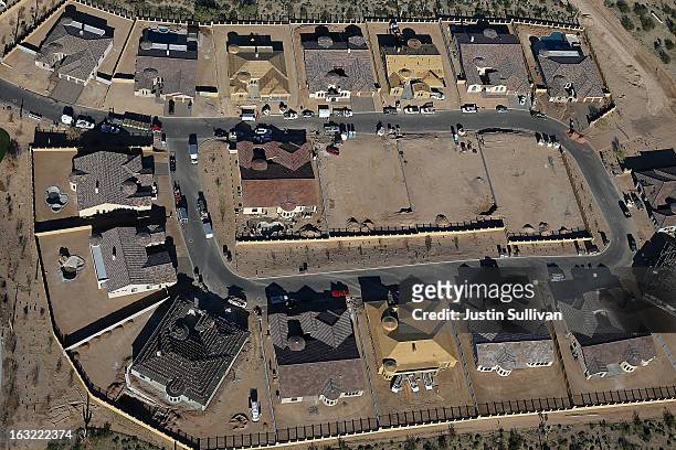 New homes are under construction at a housing development on March 6, 2013 in Mesa, Arizona. In 2008, Phoenix, Arizona was at the forefront of the...