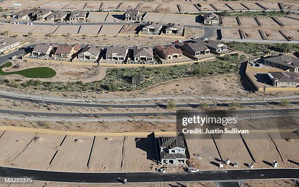 New homes are under construction at a housing development on March 6, 2013 in Mesa, Arizona. In 2008, Phoenix, Arizona was at the forefront of the...