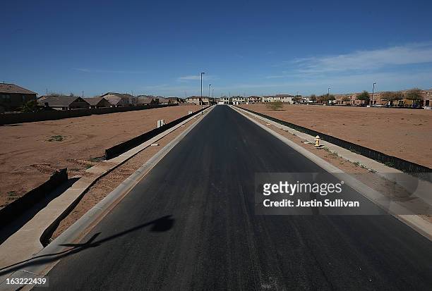 Empty parcels of land are seen at a new housing development on March 6, 2013 in Gilbert, Arizona. In 2008, Phoenix, Arizona was at the forefront of...