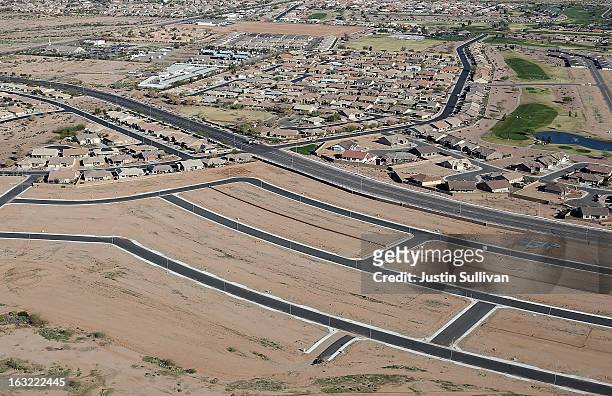 Paved roads and empty parcels of land are seen at a new housing development on March 6, 2013 in Mesa, Arizona. In 2008, Phoenix, Arizona was at the...