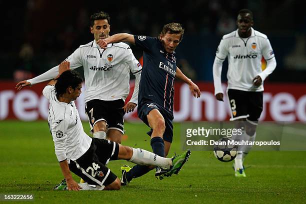 Clement Chantome of PSG and Tino Costa of Valencia battle for the ball during the Round of 16 UEFA Champions League match between Paris St Germain...
