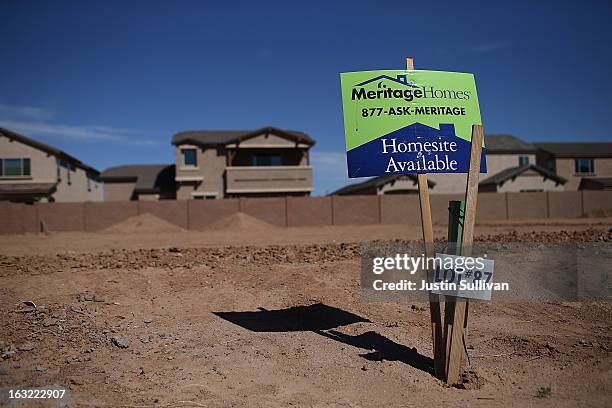 Sign is posted on a parcel of land at a new housing development on March 6, 2013 in Gilbert, Arizona. In 2008, Phoenix, Arizona was at the forefront...