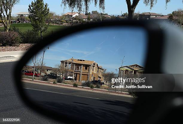 New homes are under construction at a housing development on March 6, 2013 in Gilbert, Arizona. In 2008, Phoenix, Arizona was at the forefront of the...