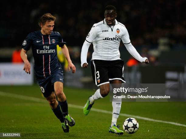 Clement Chantome of PSG and Aly Cissokho of Valencia battle for the ball during the Round of 16 UEFA Champions League match between Paris St Germain...