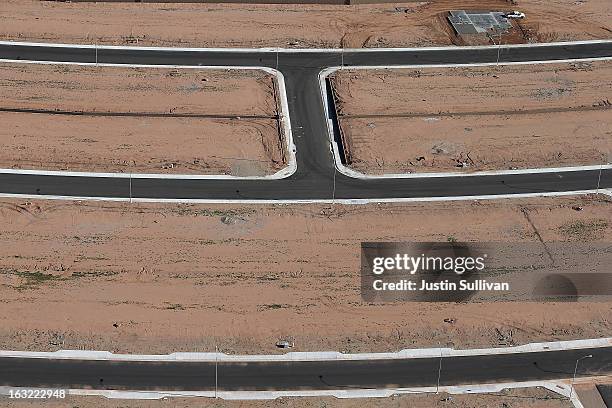 Newly paved roads are seen at a new housing development on March 6, 2013 in Mesa, Arizona. In 2008, Phoenix, Arizona was at the forefront of the U.S....