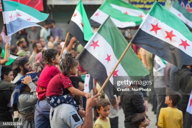 Protests in the city of Jandairis in northwestern Syria in support of the revolutionary movement against the Assad regime in the provinces of Sweida...