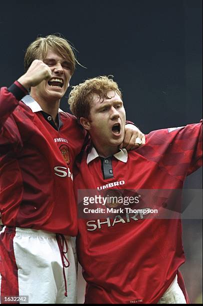 David Beckham and Paul Scholes of Manchester United celebrate during the FA Carling Premiership match against Wimbledon at Old Trafford in...