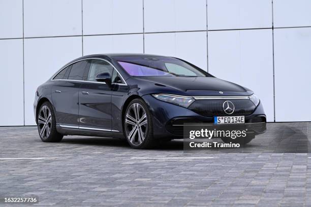 mercedes-benz eqs on a street - mercedes benz stockfoto's en -beelden