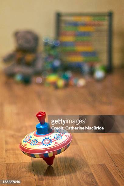 in a spin... - spinning top stock pictures, royalty-free photos & images