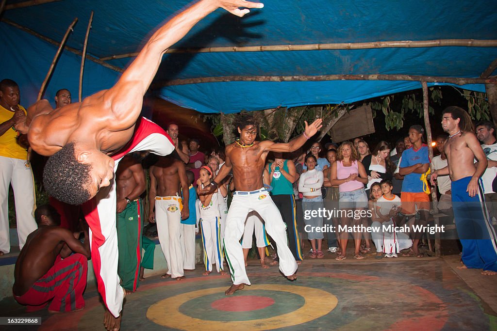 A group class practices Capoeira