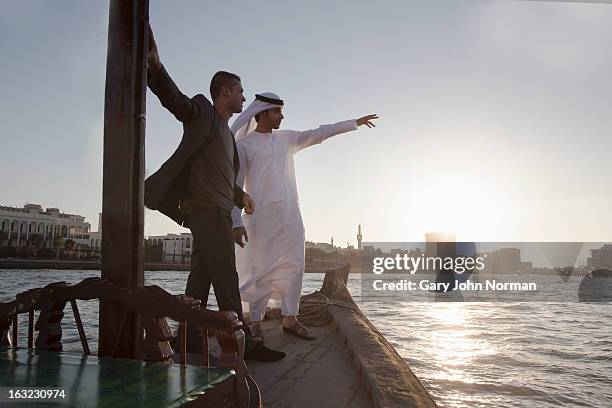 two middle eastern businessmen, dubai creek - the united arab emirates stock pictures, royalty-free photos & images