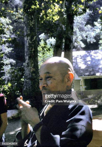 Japanese monk Shunryu Suzuki gives meditation instructions in the courtyard of the Tassajara Zen Center , Carmel Valley, California, 1967.