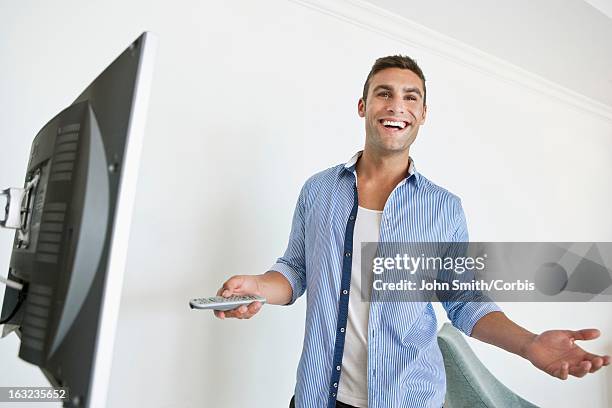 Man Using Remote Control 690 Man Standing With Tv Remote Stock Photos, High-Res Pictures, and ...