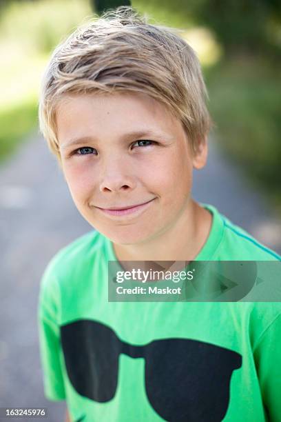 close-up portrait of a caucasian pre-adolescent boy smiling - season 13 stock-fotos und bilder