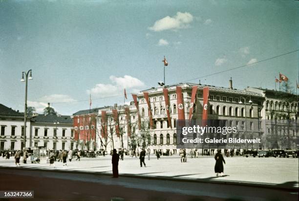 Buildings are decorated with swastika flags in the downtown area near the Lustgarten, where Adolf Hitler , chancellor of Germany, delivered a speech...