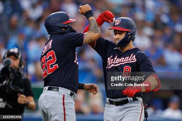 Carter Kieboom and Dominic Smith of the Washington Nationals celebrate Kieboom's two-run home run in the second inning of their MLB game against the...