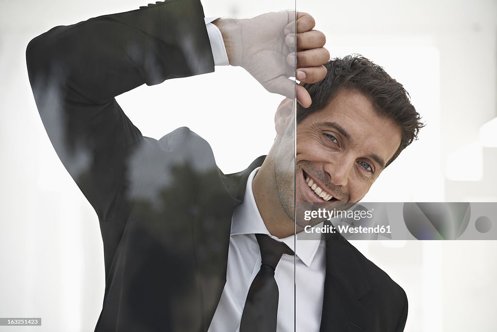 Spain, Businessman smiling, portrait