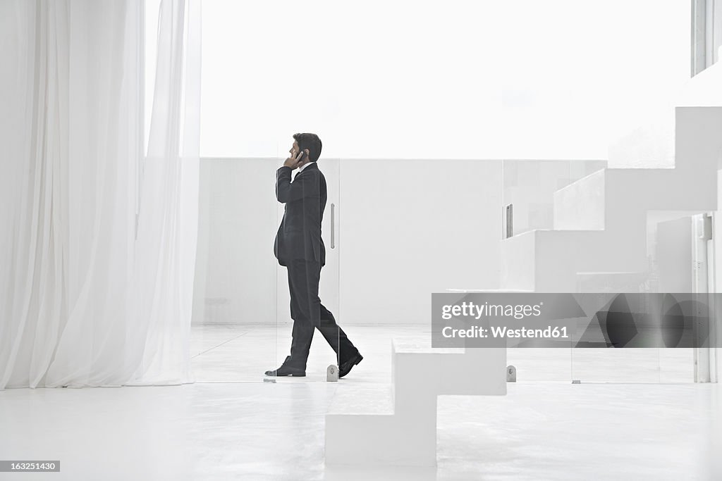 Spain, Businessman talking on mobile phone