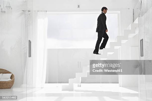 spain, businessman cimbing up stairs - 階段　のぼる ストックフォトと画像