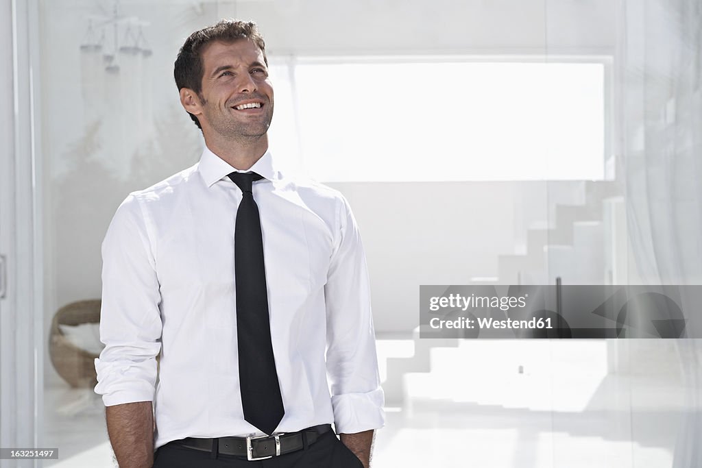 Spain, Businessman thinking, smiling