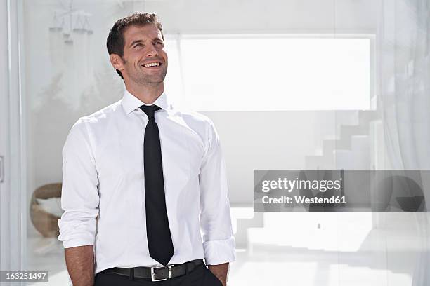 spain, businessman thinking, smiling - tie bildbanksfoton och bilder