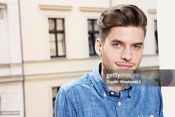 germany, berlin, young man smiling, portrait - quiff stock pictures, royalty-free photos & images