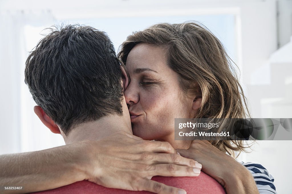 Spain, Mid adult woman kissing to man