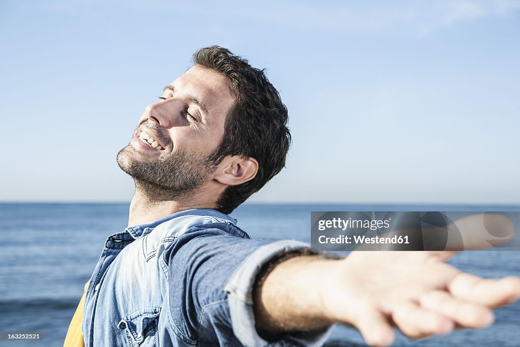 Spain, Mid adult man smiling