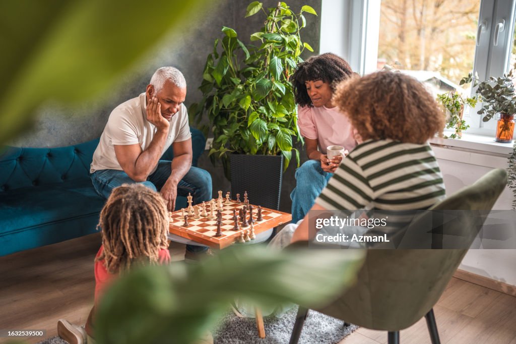 Chess Family Rvt Family Chess Game Night High-Res Stock Photo - Getty Images