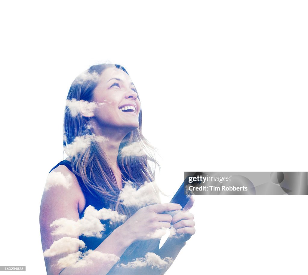 Woman with smart phone and clouds