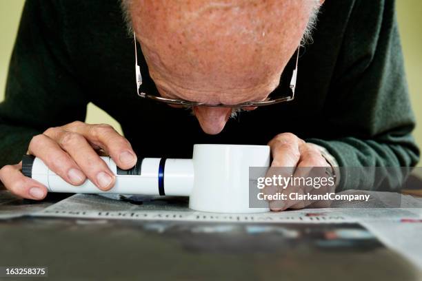 old man dealing with macular degeneration - macular degeneration stock pictures, royalty-free photos & images