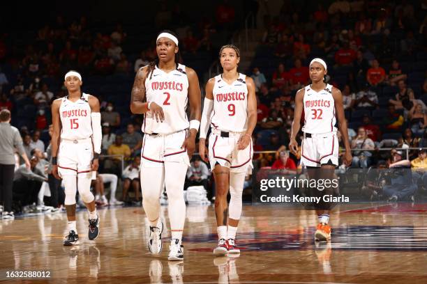 Brittney Sykes, Myisha Hines-Allen, Natasha Cloud and Shatori Walker-Kimbrough of the Washington Mystics look on during the game against the...