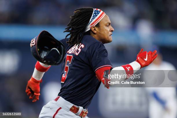 Abrams of the Washington Nationals beats a throw to first to record a single in the third inning of their MLB game against the Toronto Blue Jays at...