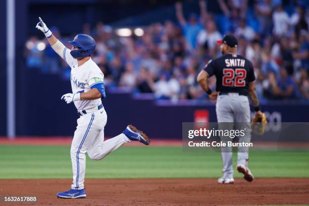 Davis Schneider of the Toronto Blue Jays runs out a solo home run in the third inning of their MLB game against the Washington Nationals at Rogers...