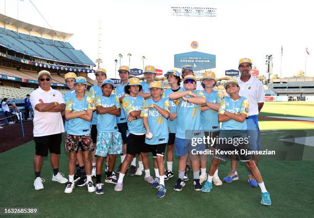 The Little League World Series champions from El Segundo pose for a photo before the start of a baseball game between Arizona Diamondbacks and Los...