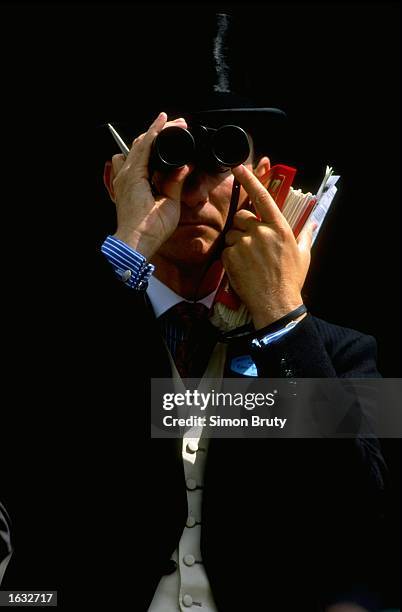 Racegoer looking through his binnoculars, on Ladies Day at Royal Ascot, Windsor, England. \ Mandatory Credit: Simon Bruty/Allsport