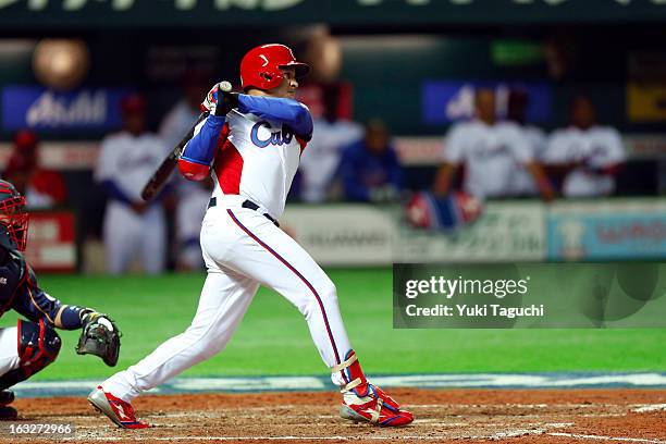 Frederich Cepeda of Team Cuba hits a RBI double in the bottom of the fourth inning during Pool A, Game 6 between Team Japan and Team Cuba during the...