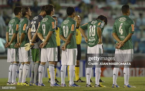 Brazil's Palmeiras football team players pay homage to late Uruguayan footballer Luis Cubilla before their Copa Libertadores 2013 Group 2 football...