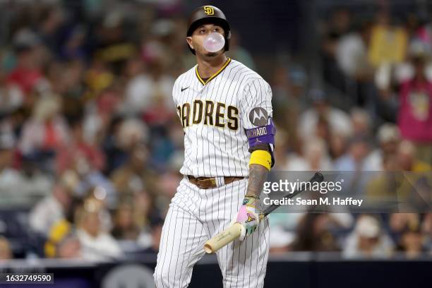 Manny Machado of the San Diego Padres looks on after striking out during the fourth inning of a game against the Miami Marlins at PETCO Park on...