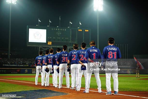 Members of Team Chinese Taipei are seen on the third base path during the playing of the National Anthems before Pool B, Game 6 between Team Chinese...