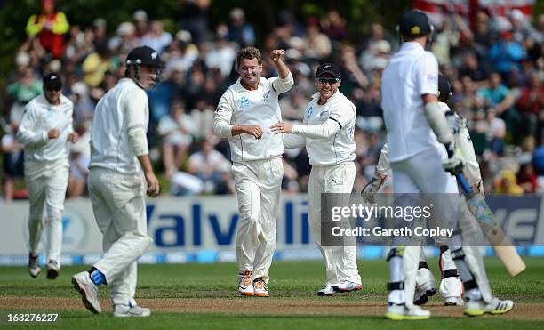 Bruce Martin of New Zealand celebrates with teammates after dismissing Stuart Broad of England during day two of the First Test match between New...