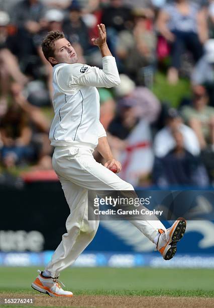 Bruce Martin of New Zealand bowls during day two of the First Test match between New Zealand and England at University Oval on March 7, 2013 in...