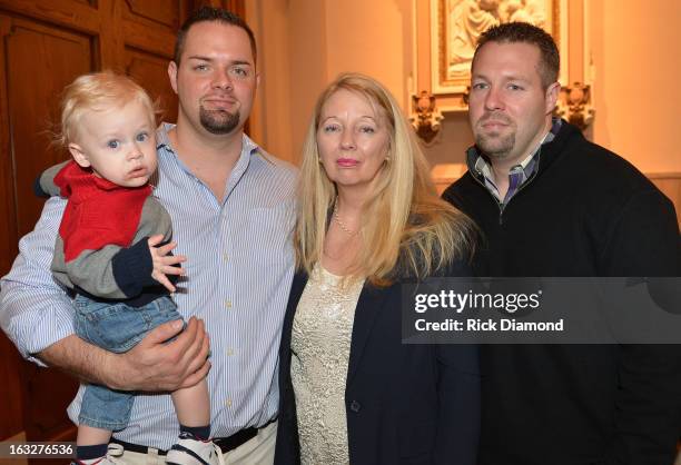 Mindy's Nephew, Brother Tim McCready, Mother Gayle Inge and BrotherJosh McCready attend the memorial service for Mindy McCready at Cathedral of the...