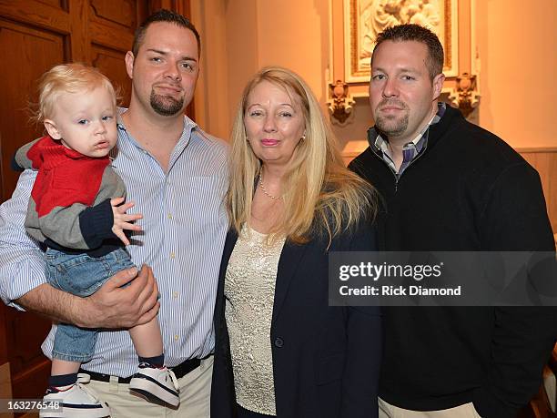 Mindy's Nephew, Brother Tim McCready, Mother Gayle Inge and BrotherJosh McCready attend the memorial service for Mindy McCready at Cathedral of the...