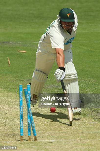 Mark Cosgrove of the Tigers is run out by Greg Moller of the Bulls during day one of the Sheffield Shield match between the Queensland Bulls and the...