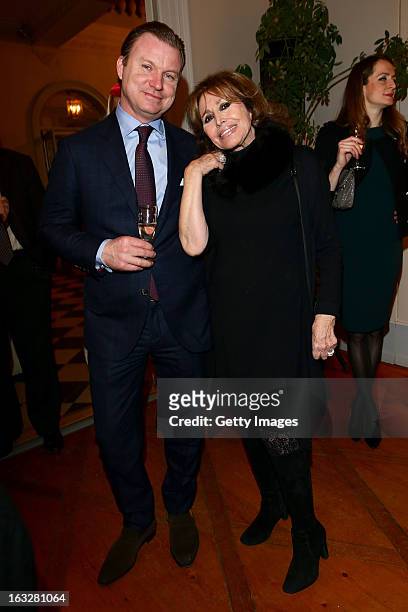 Elizabeth Washer and guest attend the charity auctioning of the first "Citroen DS3 Cabrio L'Uomo Vogue" hosted by L'Uomo Vogue and Citroen at the...