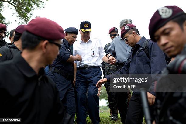 Malaysia's Prime Minister Najib Razak , accompanied by the General of the Royal Malaysian Police Ismail Omar and Malaysian Defence Minister Zahid...