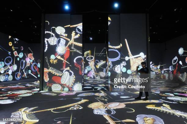 Visitors enjoy an immersive look at "Ancient jewelry" in the digital exhibition hall of the new Zhejiang Museum in Hangzhou, Zhejiang province,...